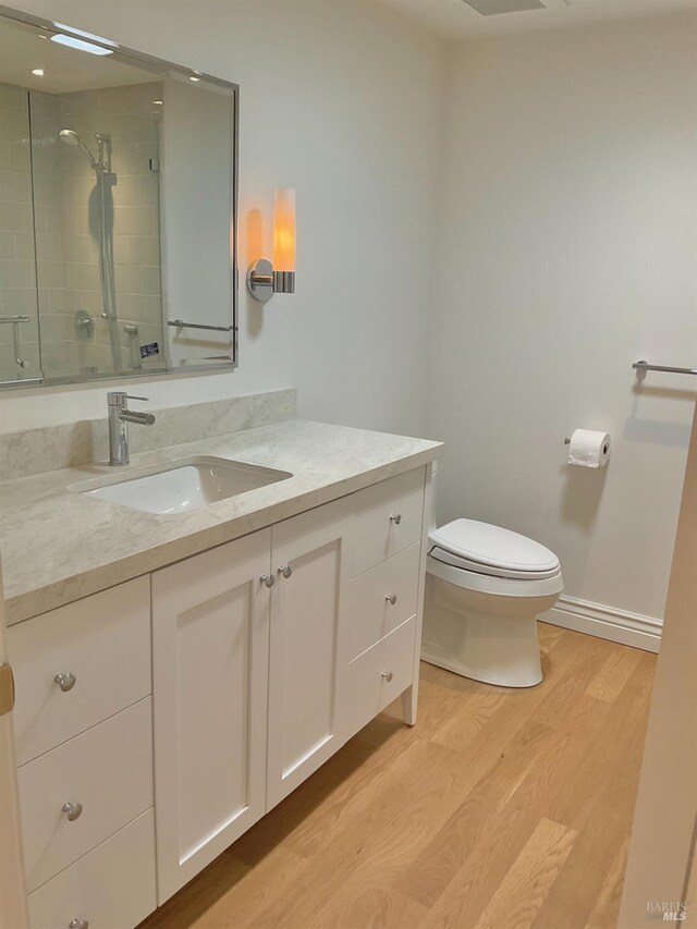164 Oak Island Dr, Santa Rosa, CA 95409 - bathroom with vanity, wood finished floors, and a tile shower
