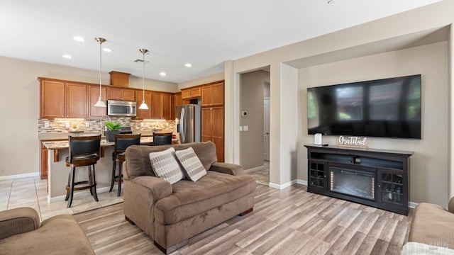 524 Chaparral Loop, Vacaville, CA 95688 - living room featuring recessed lighting, a fireplace, and light wood finished floors