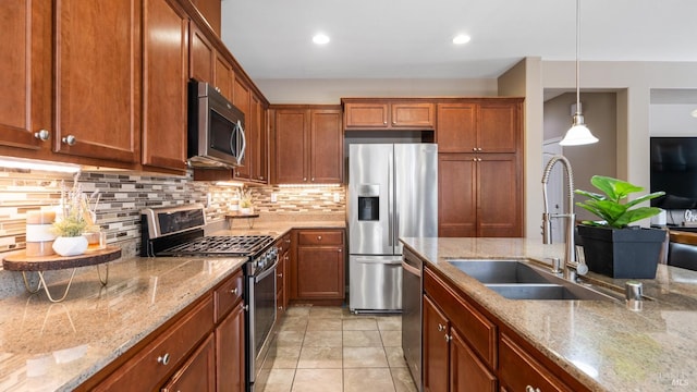 524 Chaparral Loop, Vacaville, CA 95688 - kitchen featuring stainless steel appliances, decorative backsplash, brown cabinetry, and recessed lighting