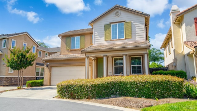 524 Chaparral Loop, Vacaville, CA 95688 - traditional-style house with a tile roof, a garage, driveway, and stucco siding