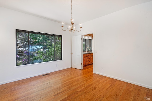 3604 Holly Ridge Dr, Santa Rosa, CA 95409 - empty room featuring a chandelier and light wood-style flooring