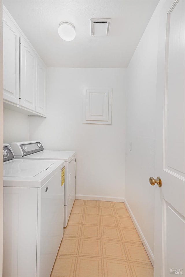3604 Holly Ridge Dr, Santa Rosa, CA 95409 - laundry area with washing machine and clothes dryer, light floors, and cabinet space