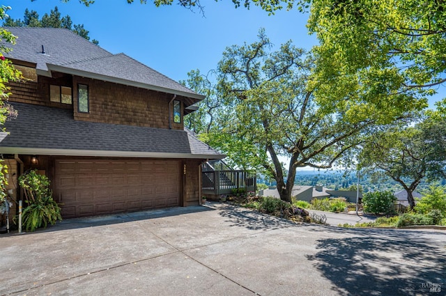 3604 Holly Ridge Dr, Santa Rosa, CA 95409 - view of home's exterior with an attached garage, roof with shingles, and concrete driveway