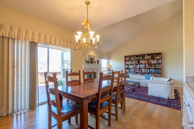 6327 Meadowridge Dr, Santa Rosa, CA 95409 - dining space with light wood-style floors, a chandelier, and vaulted ceiling