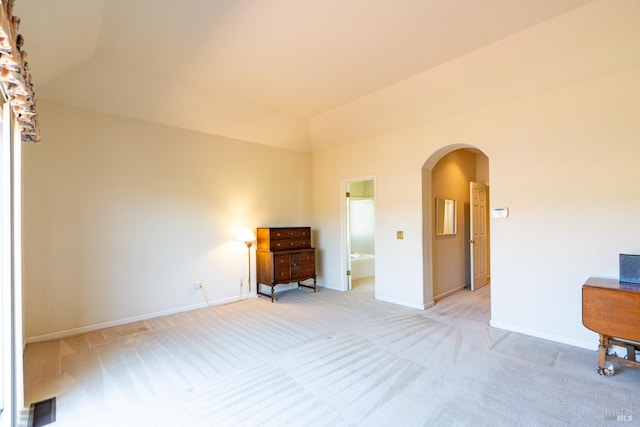 6327 Meadowridge Dr, Santa Rosa, CA 95409 - spare room featuring arched walkways, light carpet, and vaulted ceiling