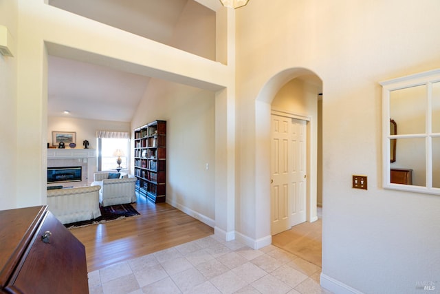 6327 Meadowridge Dr, Santa Rosa, CA 95409 - hallway with light tile patterned floors, arched walkways, and high vaulted ceiling