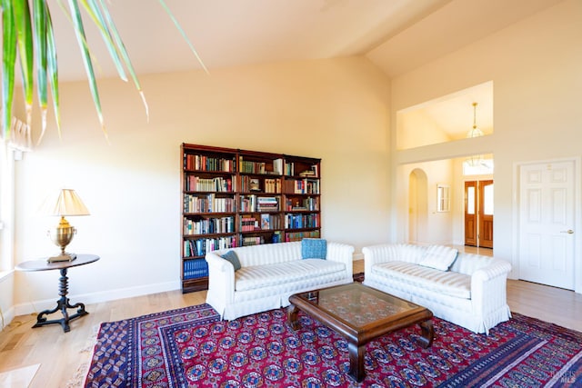 6327 Meadowridge Dr, Santa Rosa, CA 95409 - living area with wood finished floors, high vaulted ceiling, and arched walkways