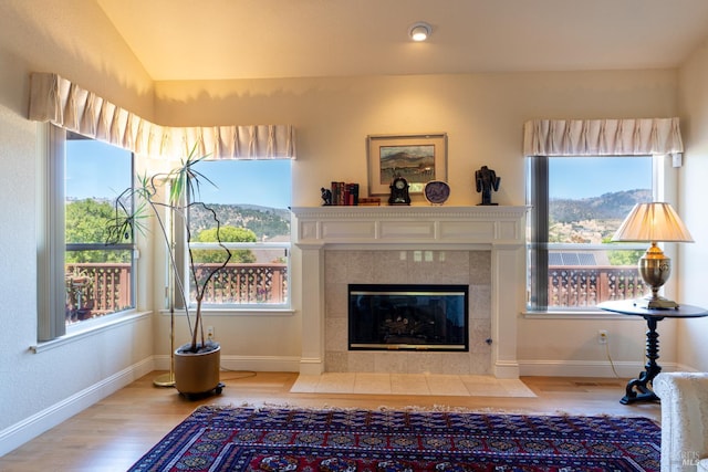 6327 Meadowridge Dr, Santa Rosa, CA 95409 - living room featuring wood finished floors, a tile fireplace, and vaulted ceiling