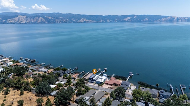 aerial perspective of suburban area with a water and mountain view