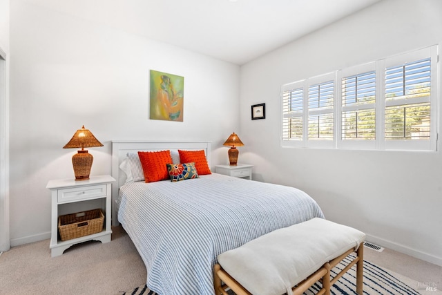 carpeted bedroom with baseboards