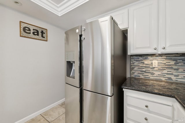 1255 Oak Ridge Ln, Pinole, CA 94564 - kitchen with stainless steel refrigerator with ice dispenser, backsplash, white cabinets, dark stone countertops, and light tile patterned floors