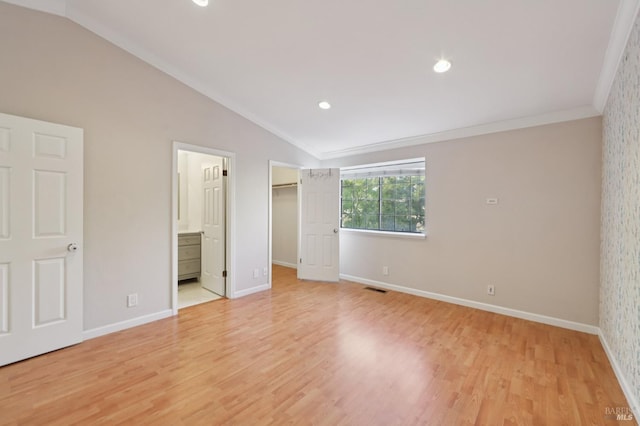 1255 Oak Ridge Ln, Pinole, CA 94564 - unfurnished bedroom featuring vaulted ceiling, light wood-type flooring, crown molding, a walk in closet, and ensuite bath