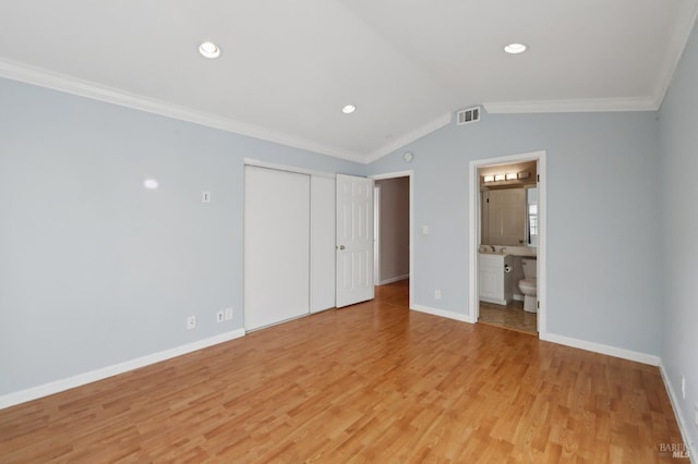 1255 Oak Ridge Ln, Pinole, CA 94564 - unfurnished bedroom with vaulted ceiling, light wood-style floors, crown molding, a closet, and recessed lighting