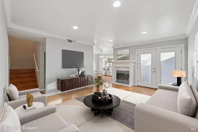 1255 Oak Ridge Ln, Pinole, CA 94564 - living area featuring crown molding, stairs, light wood-style flooring, recessed lighting, and french doors