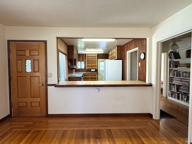 716 Mountain View Ave, Petaluma, CA 94952 - kitchen featuring freestanding refrigerator, tile countertops, a peninsula, and wood finished floors