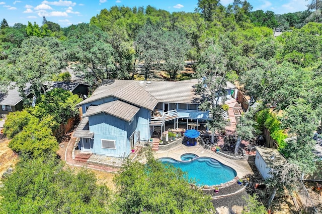 2588 King Edward Ct, El Dorado Hills, CA 95762 - back of house with a fenced backyard, a pool with connected hot tub, and a patio area