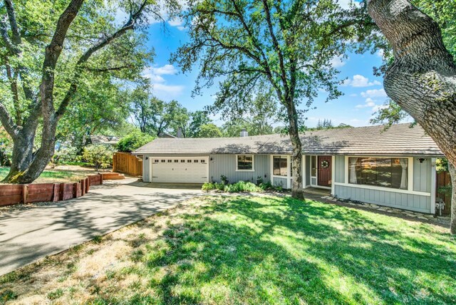 2588 King Edward Ct, El Dorado Hills, CA 95762 - ranch-style house featuring an attached garage, board and batten siding, and driveway
