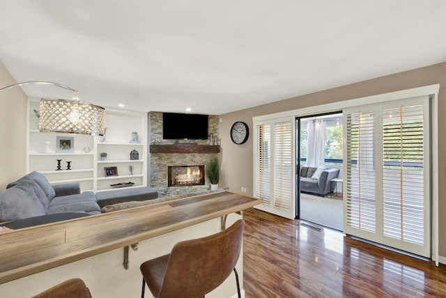2588 King Edward Ct, El Dorado Hills, CA 95762 - living room with a stone fireplace, dark wood finished floors, and built in features