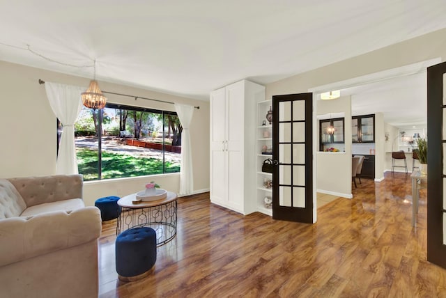 2588 King Edward Ct, El Dorado Hills, CA 95762 - living room featuring wood finished floors and a chandelier