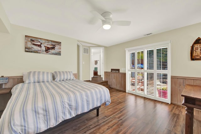 2588 King Edward Ct, El Dorado Hills, CA 95762 - bedroom with wood finished floors, a ceiling fan, and a wainscoted wall