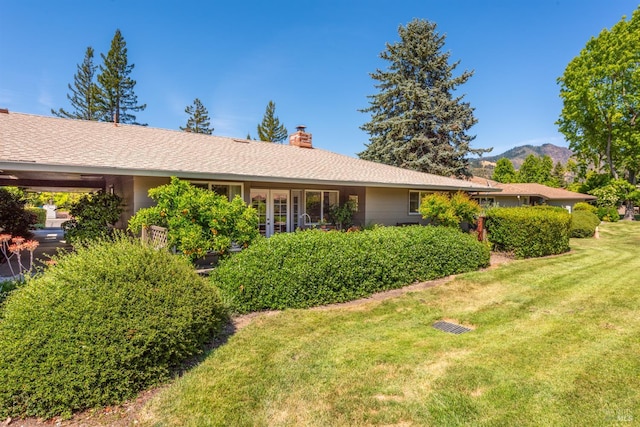 406 White Oak Dr, Santa Rosa, CA 95409 - back of house featuring a chimney, a lawn, and a mountain view