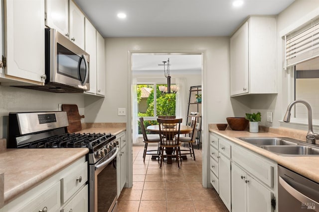 406 White Oak Dr, Santa Rosa, CA 95409 - kitchen featuring appliances with stainless steel finishes, recessed lighting, light countertops, white cabinets, and light tile patterned floors
