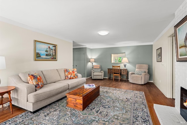 406 White Oak Dr, Santa Rosa, CA 95409 - living area with wood finished floors, a brick fireplace, and crown molding