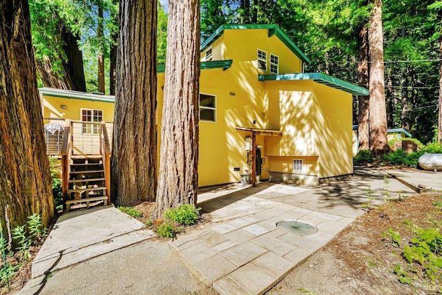2685 Austin Creek Rd, Cazadero, CA 95421 - rear view of property featuring stucco siding, a wooden deck, and stairs