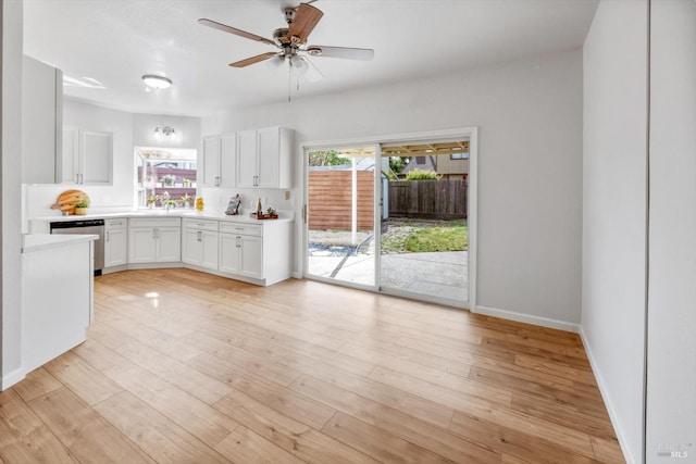 766 Calico Trl, Vacaville, CA 95687 - kitchen featuring stainless steel dishwasher, white cabinetry, a ceiling fan, and light countertops