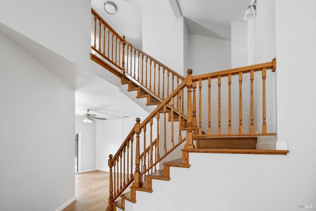 766 Calico Trl, Vacaville, CA 95687 - stairway featuring wood finished floors, ceiling fan, and a towering ceiling