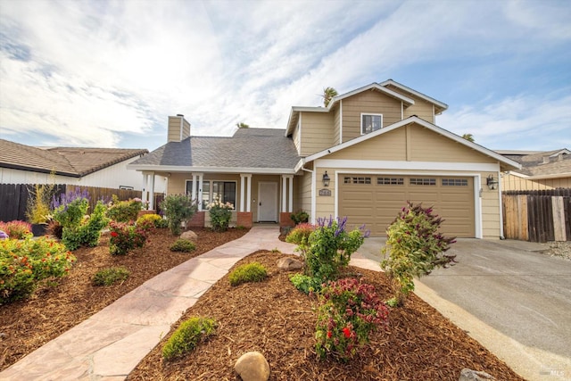 766 Calico Trl, Vacaville, CA 95687 - traditional home featuring a garage, covered porch, concrete driveway, and a chimney