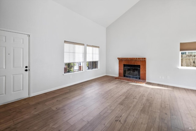 766 Calico Trl, Vacaville, CA 95687 - unfurnished living room featuring high vaulted ceiling, wood finished floors, and a fireplace
