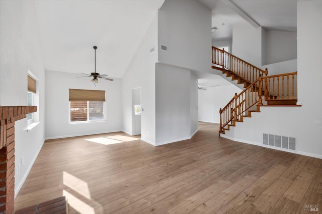 766 Calico Trl, Vacaville, CA 95687 - unfurnished living room with a ceiling fan, high vaulted ceiling, stairway, and wood finished floors
