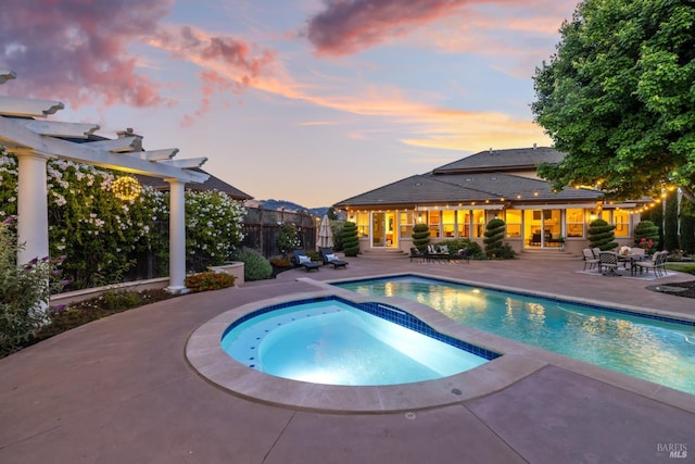 3439 Selene Ct, Santa Rosa, CA 95404 - pool at dusk featuring a patio, a pergola, and a pool with connected hot tub
