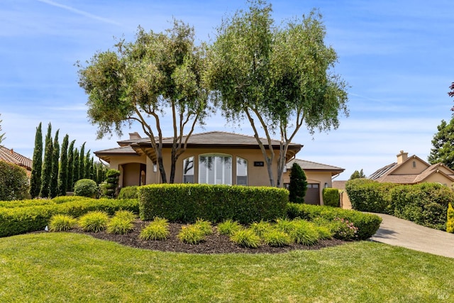 3439 Selene Ct, Santa Rosa, CA 95404 - view of front of home with stucco siding, a front yard, an attached garage, and driveway