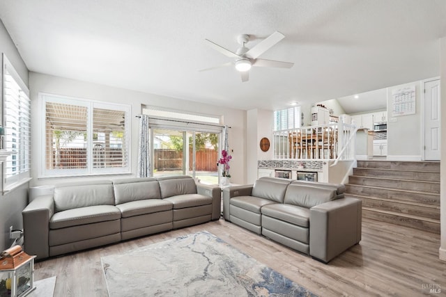 1105 Coulter Ct, Fairfield, CA 94533 - living room with plenty of natural light, a ceiling fan, wood finished floors, and stairway