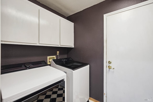 1105 Coulter Ct, Fairfield, CA 94533 - laundry room with washer and clothes dryer, cabinet space, and tile patterned floors