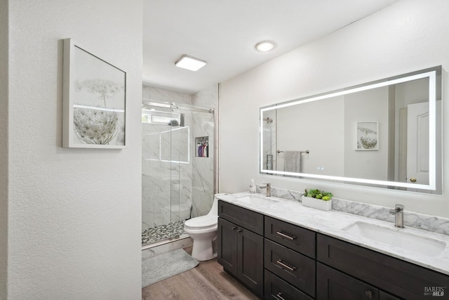 1105 Coulter Ct, Fairfield, CA 94533 - bathroom featuring a marble finish shower, double vanity, and wood finished floors