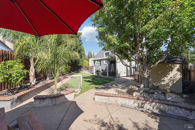 1105 Coulter Ct, Fairfield, CA 94533 - fenced backyard with a patio and an outbuilding