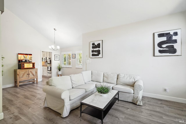 1105 Coulter Ct, Fairfield, CA 94533 - living room with a chandelier, wood finished floors, and high vaulted ceiling