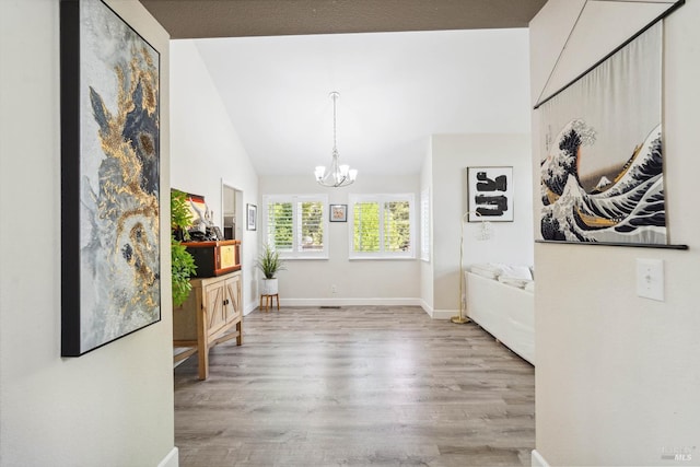 1105 Coulter Ct, Fairfield, CA 94533 - entrance foyer with wood finished floors, vaulted ceiling, and a chandelier