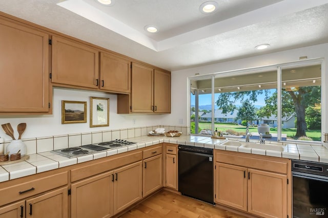 378 Miramonte Pl, Santa Rosa, CA 95409 - kitchen featuring dishwasher, electric cooktop, light wood-style flooring, recessed lighting, and tile counters