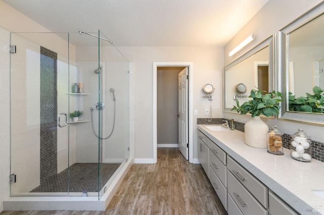 378 Miramonte Pl, Santa Rosa, CA 95409 - full bathroom featuring wood finished floors, double vanity, and a stall shower