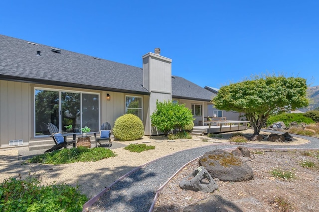 378 Miramonte Pl, Santa Rosa, CA 95409 - back of property featuring a chimney, a deck, and a shingled roof