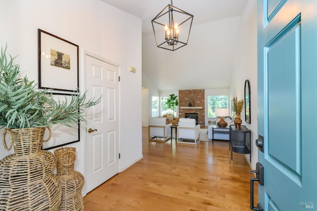 378 Miramonte Pl, Santa Rosa, CA 95409 - foyer featuring light wood-type flooring, a chandelier, a towering ceiling, and a fireplace