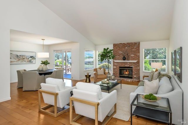 378 Miramonte Pl, Santa Rosa, CA 95409 - living area with light wood finished floors, a fireplace, and high vaulted ceiling