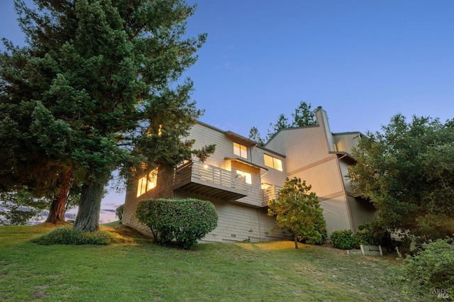 2 Columbine Ln, Novato, CA 94947 - view of side of home with a balcony, a lawn, and a chimney