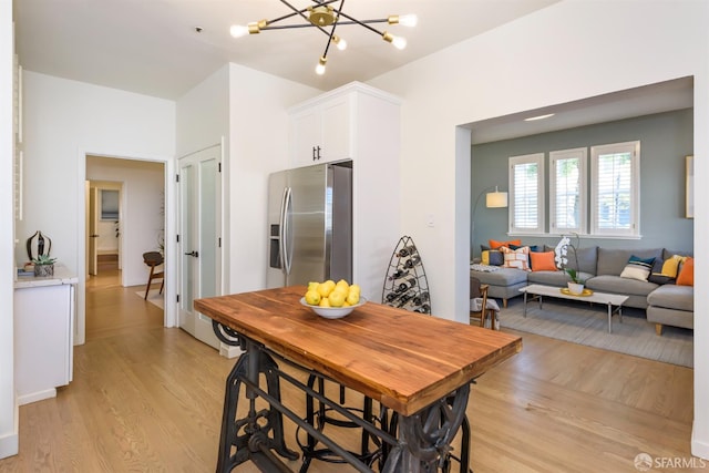 1 Hoffman Ave Unit A, San Francisco, CA 94114 - dining space featuring light wood finished floors and a chandelier