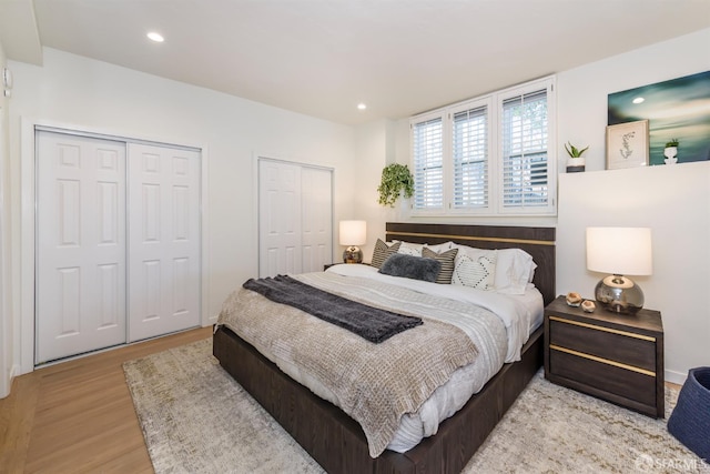 1 Hoffman Ave Unit A, San Francisco, CA 94114 - bedroom with two closets, wood finished floors, and recessed lighting
