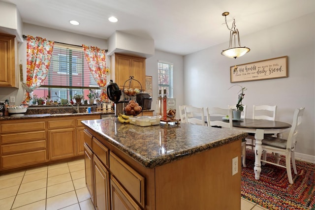 1756 Camino Real Way, Roseville, CA 95747 - kitchen featuring plenty of natural light, a kitchen island, light tile patterned flooring, hanging light fixtures, and recessed lighting